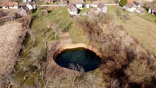 Experts say December's earthquake has accelerated the appearance of sinkholes in the area.