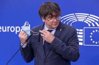 Former Catalan leader Carles Puigdemont as he prepares to address a media conference at the European Parliament in Brussels, Feb. 24, 2021.