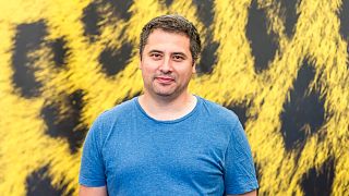 Romanian director Radu Jude poses during a photocall for the film "Inimi cicatrizate" at the 69th Locarno International Film Festival, Sunday, Aug. 7, 2016, in Locarno