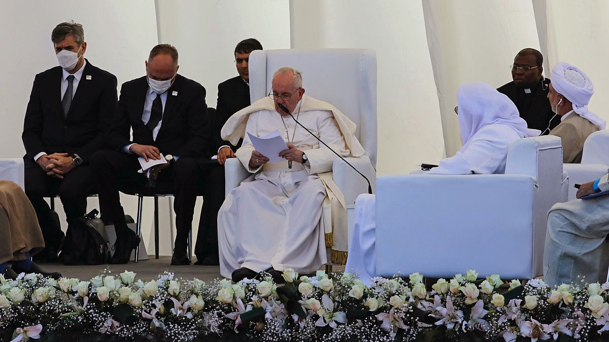 Pope Francis, center, speaks during an interreligious meeting near the archaeological site of Ur near Nasiriyah, Iraq