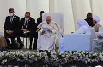 Pope Francis, center, speaks during an interreligious meeting near the archaeological site of Ur near Nasiriyah, Iraq