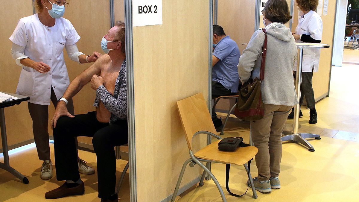 A man receives a Pfizer/BioNTech vaccine against the COVID-19 in a vaccination center of Bayonne, southwestern France.