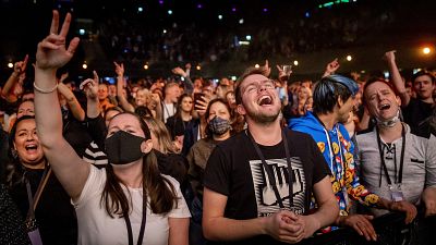 Visitors to the Ziggo Dome attend a performance by Dutch musician Phil Bee in Amsterdam on March 7 2021.