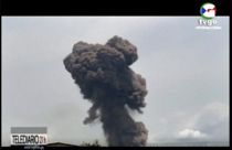 This TVGE image made from video shows smoke rising over the blast site at a military barracks in Bata, Equatorial Guinea