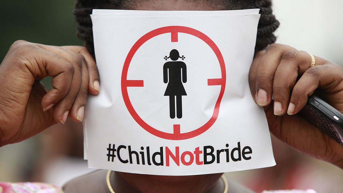 A woman protests against underage marriage in Lagos, Nigeria on July 20, 2013.