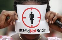 A woman protests against underage marriage in Lagos, Nigeria on July 20, 2013.