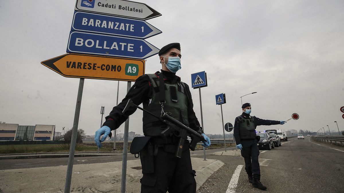 File photo: Carabinieri officers patrol one of the main access road to Bollate, in the outskirts of Milan, Italy. Feb 18, 2021.