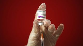 A health worker shows the media how she prepares a dose of the AstraZeneca vaccine to be administered to a patient at a vaccination centre set up in Rome.