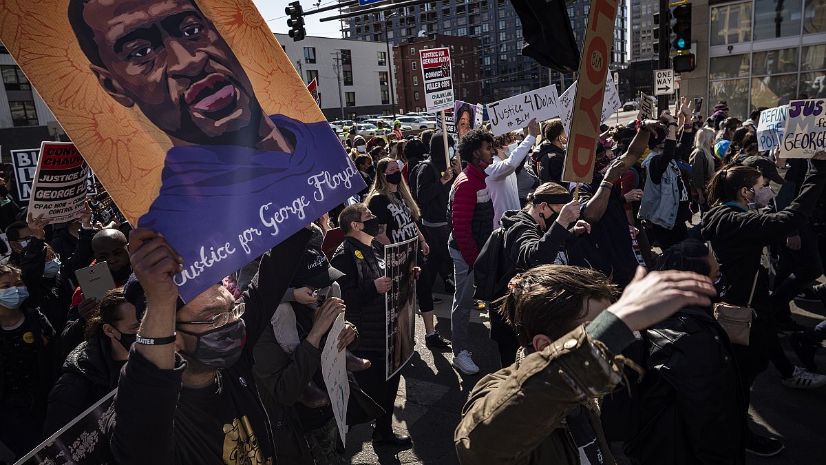 Protesters march on the first day of the Derek Chauvin trial Monday, March 8, 2021 in Minneapolis.