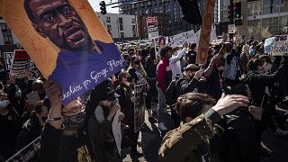 Protesters march on the first day of the Derek Chauvin trial Monday, March 8, 2021 in Minneapolis.