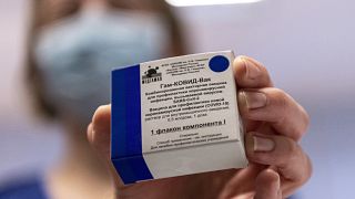 A box containing Russian vaccine Sputnik V is shown by a nurse in Budapest, Hungary.