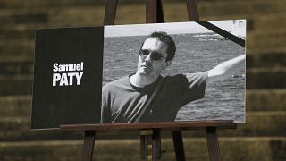 The portrait of Samuel Paty displayed on the steps of the National Assembly in Paris.