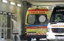 The crew of an ambulance works at a specialised COVID-19 hospital in Warsaw.