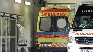 The crew of an ambulance works at a specialised COVID-19 hospital in Warsaw.