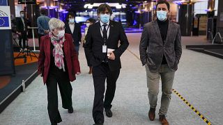 From right, MEPs Antoni Comin, Carles Puigdemont and Clara Ponsati speak with each other prior to a media conference at the European Parliament in Brussels. March 9, 2021., 