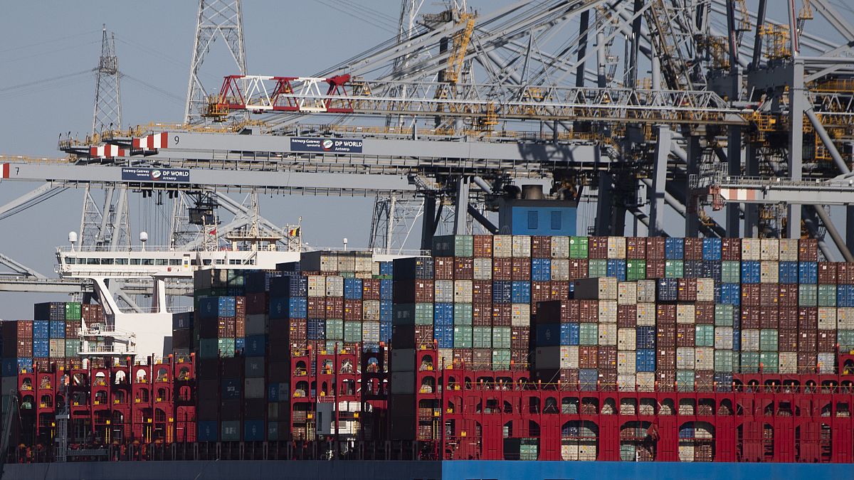 Shipping containers are offloaded in Antwerp, March 2020. Belgian prosecutors say a huge police operation against organised crime took place across Belgium on March 9, 2021.
