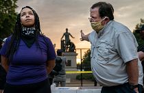 Anais (26) argues for the removal of the Emancipation Memorial with a man (right) who wishes to keep it, in Lincoln Park, Washington DC, USA. June 25, 2021