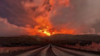A glowing river of lava gushes from the slopes of Mt Etna, Europe's largest active volcano, near Zafferana Etnea, Sicily