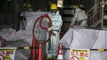 Archive image of a worker at a water treatment facility at the Fukushima nuclear power plant, Japan