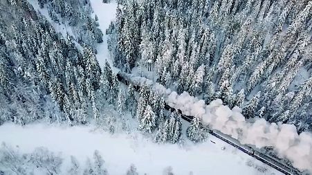 A traditional steam train chugs its way through Karelia, Russia.