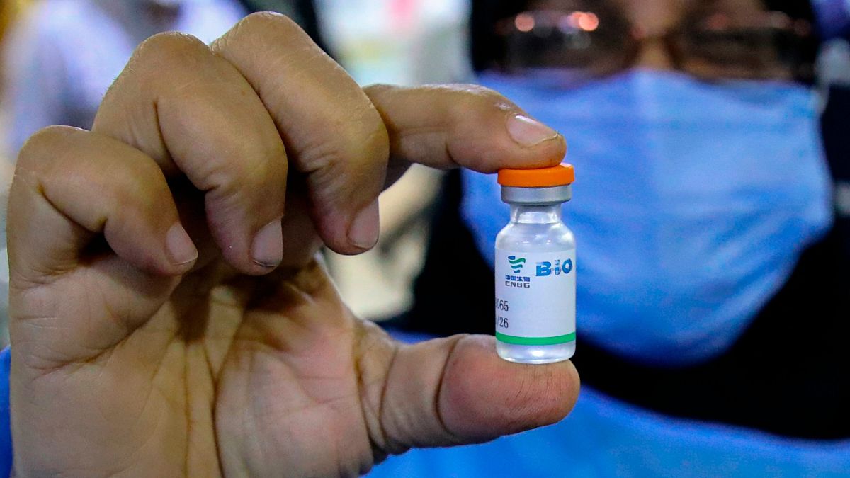 A health worker holds a vial of the Sinopharm coronavirus vaccine during the vaccination of health personnel, at a clinic in Basra, Iraq, March 3, 2021. 
