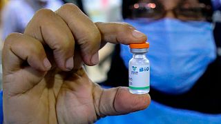 A health worker holds a vial of the Sinopharm coronavirus vaccine during the vaccination of health personnel, at a clinic in Basra, Iraq, March 3, 2021.