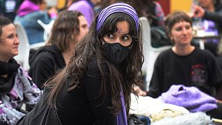 Women take part in a demonstration marking the International Women's Day in Seville