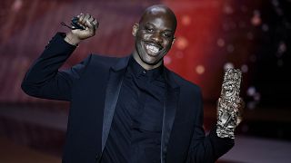 French actor Jean-Pascal Zadi poses with his trophy after receiving the Best Male Newcomer award for "Simply Black" during the 46th Cesar Award ceremony, March 12, 2021.