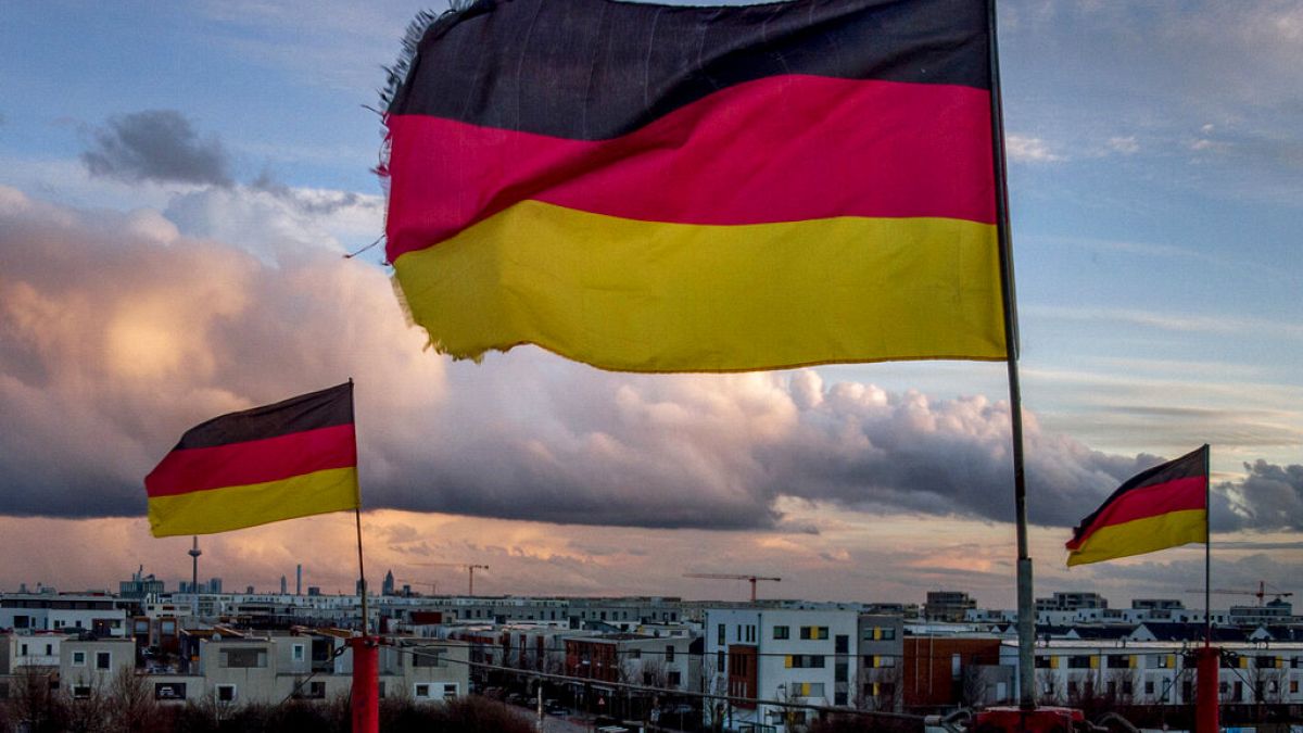 German flags wave in the wind on poles of a small circus in Frankfurt, Germany, March 13, 2021. 