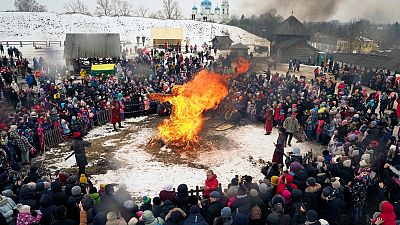 People watch as an effigy of Lady Maslenitsa burns during celebrations of Maslenitsa