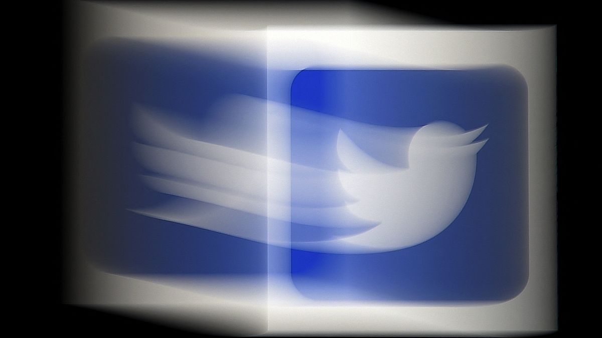 (FILES) In this file photo illustration, a Twitter logo is displayed on a mobile phone on August 10, 2020, in Arlington, Virginia
