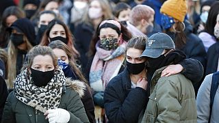 People gather, at the band stand in Clapham Common, in memory of Sarah Everard, after an official vigil was cancelled, in London, Saturday, March 13, 2021