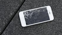 A broken Apple iPhone in need of repairs.