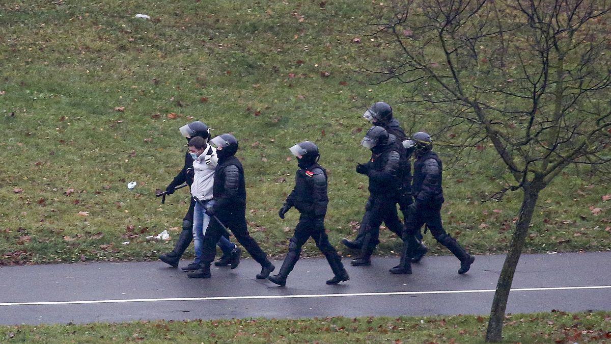Belarusian riot police detain a demonstrator during an opposition rally in Minsk in November.