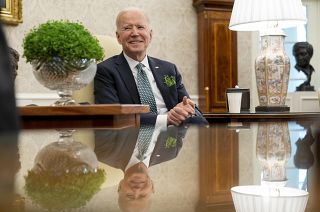 President Joe Biden speaks during a virtual meeting with Ireland's Prime Minister Micheal Martin on St. Patrick's Day, in the Oval Office of the White House.