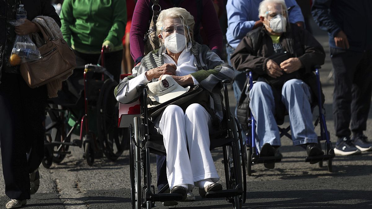 Elderly people are wheeled away after getting their shot of the COVID-19 Pfizer vaccine in Mexico City, on Monday, March 8, 2021. 