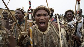 S. Africa's Zulu mourners accompany their late King with dance