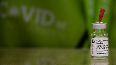 A pharmacist prepares to fill a syringe from a vial of the AstraZeneca COVID-19 vaccine at the Vaccine Village in Antwerp, Belgium on Tuesday, March 16, 2021. A pharmacist prepares to fill a syringe from a vial of the AstraZeneca COVID-19 vaccine at the Vaccine Village in Antwerp, Belgium on Tuesday, March 16, 2021.