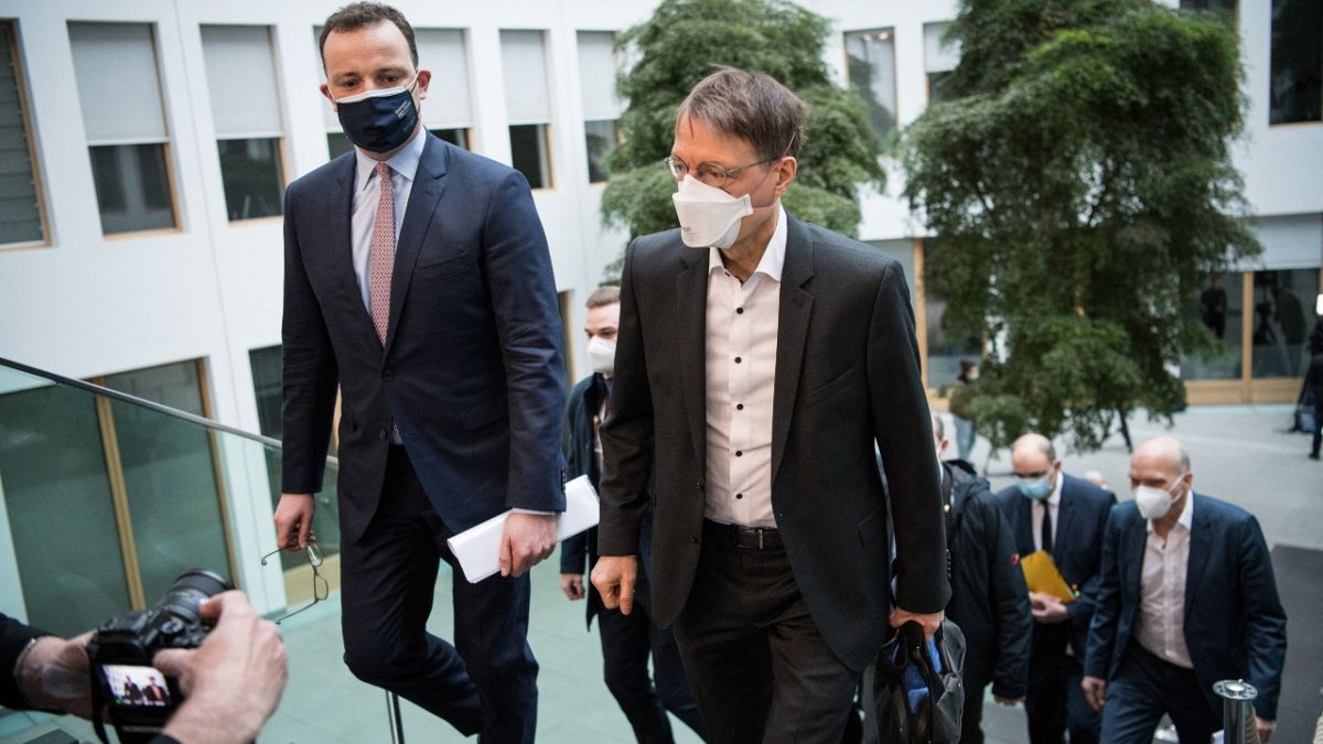 German Health Minister Jens Spahn (L) arrives for a news conference on March 19, 2021 in Berlin, amid the novel coronavirus / COVID-19 pandemic.