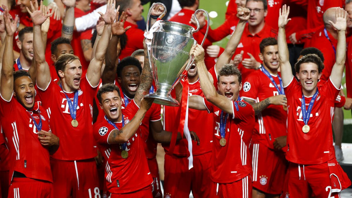 Munich players lift the trophy after Munich won the Champions League final soccer match between Paris Saint-Germain and Bayern Munich at the Luz stadium in Lisbon,
