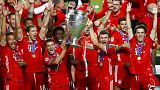 Munich players lift the trophy after Munich won the Champions League final soccer match between Paris Saint-Germain and Bayern Munich at the Luz stadium in Lisbon,