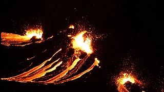 In this still image captured from a video filmed by the Icelandic Coast Guard, lava flows from the erupting Fagradalsfjall volcano, March 19, 2021.