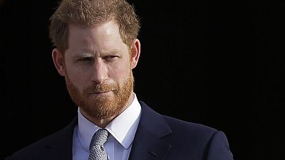In this Thursday, Jan. 16, 2020,file photo, Britain's Prince Harry arrives in the gardens of Buckingham Palace in London.