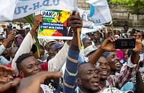 Supporters of opposition presidential candidate Guy Brice Parfait Kolelas cheer during their party's last rally of the presidential campaign in Brazzaville, Congo.