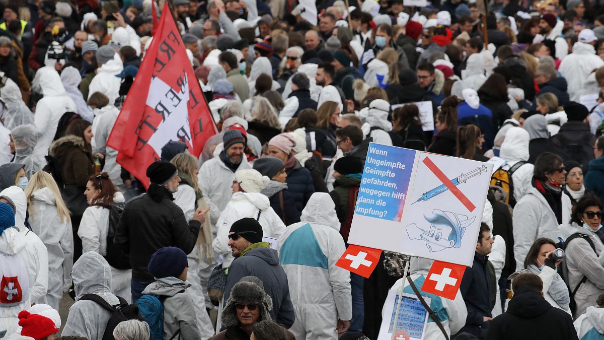 Protesters take part in a demonstration against the ongoing coronavirus Covid-19 restrictions in Liestal, near Basel, Switzerland, on March 20, 2021. 