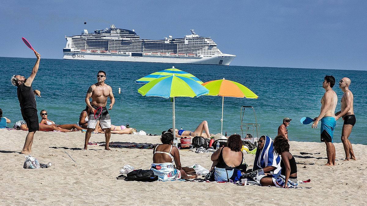 Beach goers enjoy the beautiful weather at the beach, Wednesday, March 2, 2021 in Miami Beach