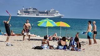 Beach goers enjoy the beautiful weather at the beach, Wednesday, March 2, 2021 in Miami Beach