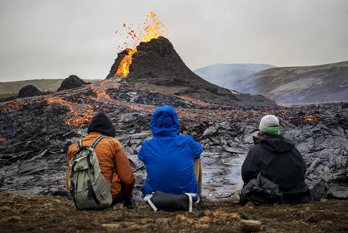 Watch as active volcano provides stunning spectacle for hikers and ...