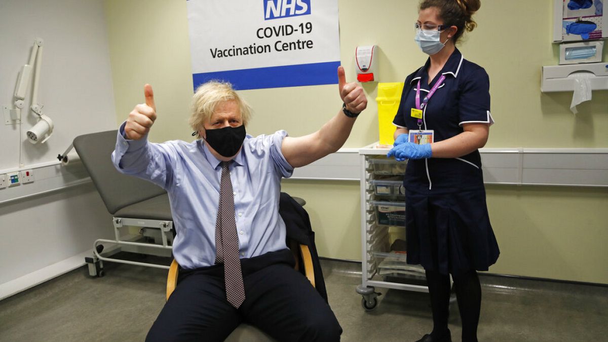 FILE - Britain's Prime Minister Boris Johnson gestures after receiving the first dose of the AstraZeneca vaccine in London, Friday, March 19, 2021. 