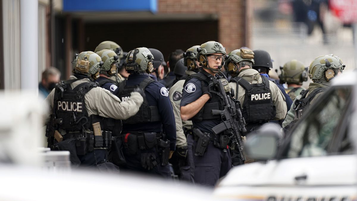 Police stand outside King Soopers grocery store after a mass shooting, Monday, March 22, 2021, Boulder, Colorado, United States